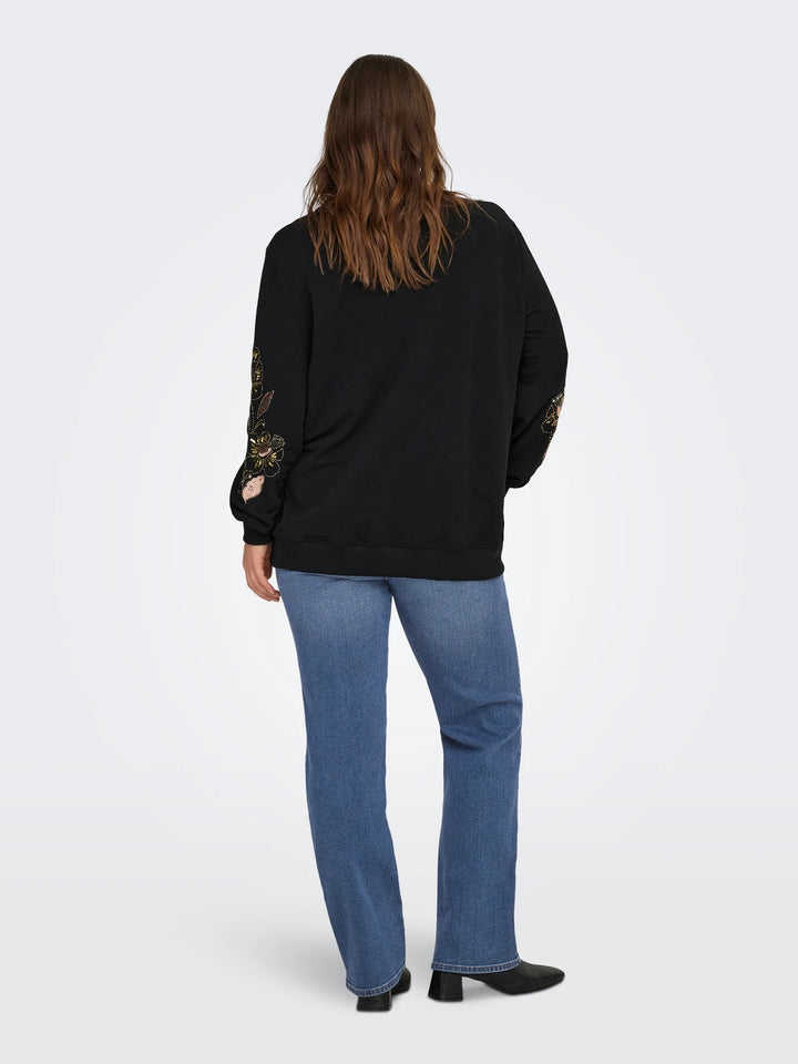 Sweater met pailletten en parels